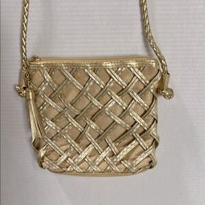Tianni gold crossbody bag.  Braided strap, basketweave front.